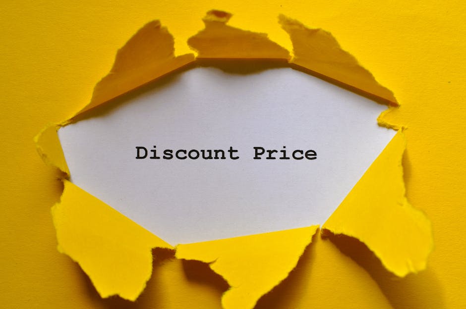A torn piece of bright yellow paper reveals a white background with the words 'Discount Price' printed in black typewriter-style font at the center. The torn edges of the yellow paper are uneven and curled, creating a textured frame around the message. The background surrounding the torn paper is also yellow, matching the color of the paper, and enhancing the visibility of the central text. The image has a flat lighting style with soft shadows around the torn edges, emphasizing the three-dimensionality of the ripped paper. Although primarily a promotional message on paper, the image's visual style can be associated with offering savings or special deals related to rubbish clearance or waste management services, subtly connecting to the theme of alternative waste disposal options offered by waste clearance companies like Waste Clearance Barnet.